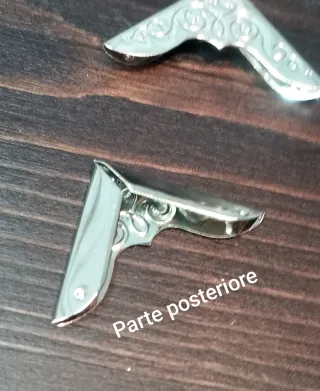 Lotto 12 Angolieri Metallo Decorati Argento