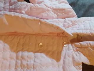 Giubbino neonato rosa trapuntato con cappuccio