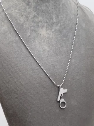 Colgante pistola y esposas acero quirúrgico