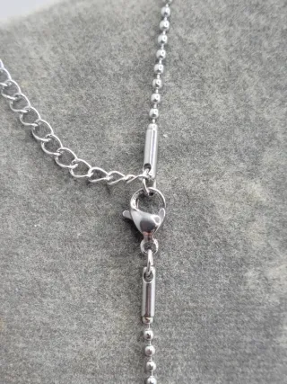 Colgante pistola y esposas acero quirúrgico