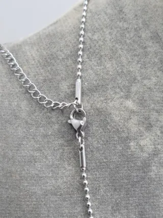 Colgante pistola y esposas acero quirúrgico