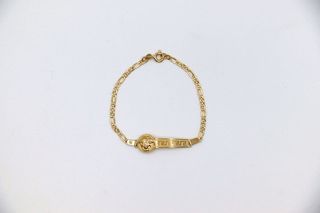 ESCLAVA DE NIÑO MEDUSA Y GRECA. Oro 18k.