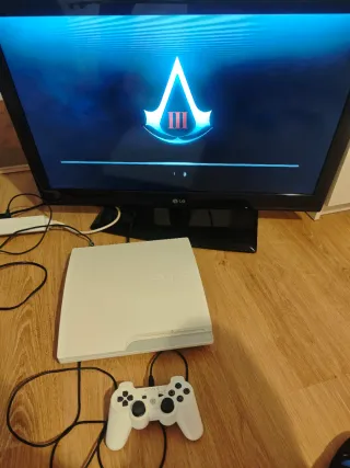 PS3 Slim Blanca + 4 Juegos