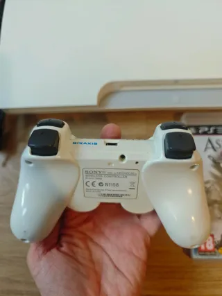 PS3 Slim Blanca + 4 Juegos