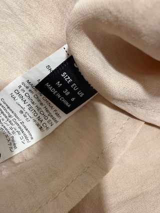 Blusa beige con lazos negros