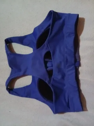 Top deportivo azul con cremallera