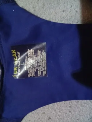 Top deportivo azul con cremallera