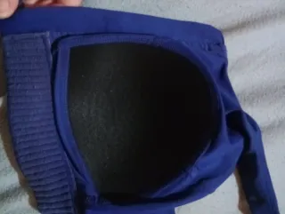 Top deportivo azul con cremallera