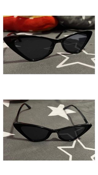 Gafas de sol negras con diseño ojo de gato.