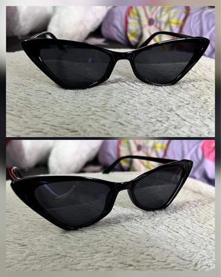 Gafas de sol negras con diseño ojo de gato.