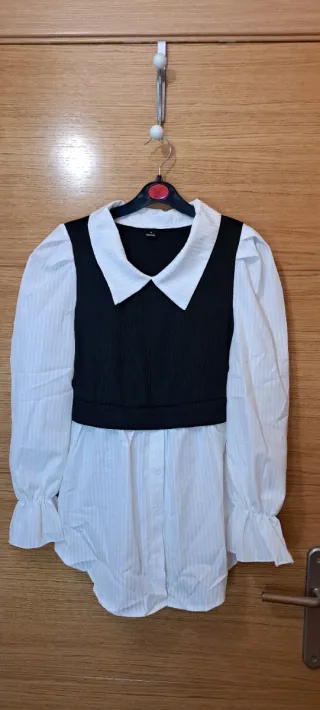 Blusa blanca con chaleco negro