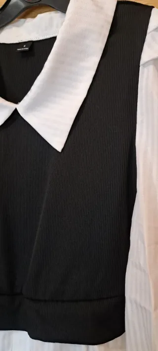 Blusa blanca con chaleco negro