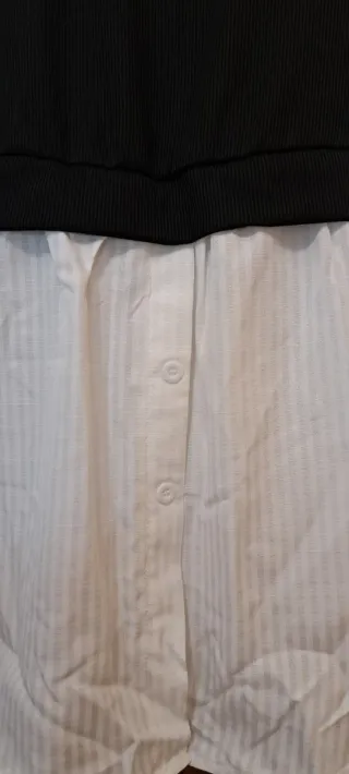 Blusa blanca con chaleco negro