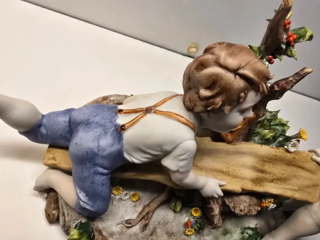 Figura porcelana alemana antigua niños balancín