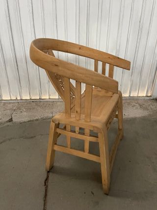 Sillón de madera tallada estilo oriental