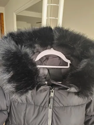 Plumífero largo Mango negro También sirve una S