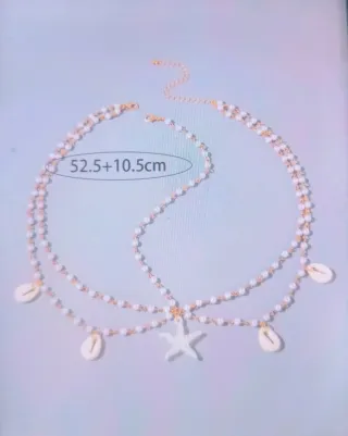 Colgante de pelo con estrellas y conchas