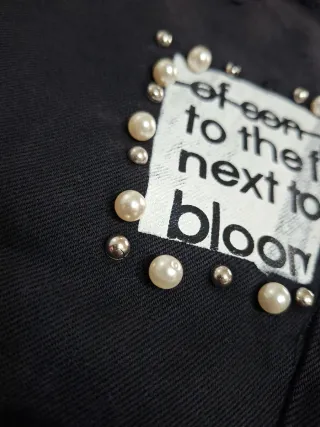 Jeans neri donna strappati con perle