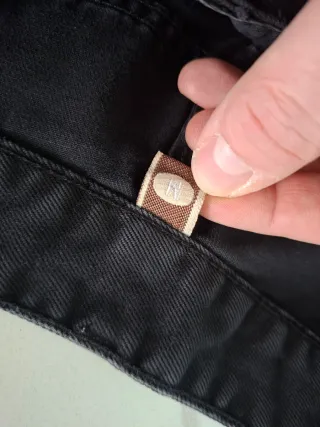 Jeans neri donna strappati con perle