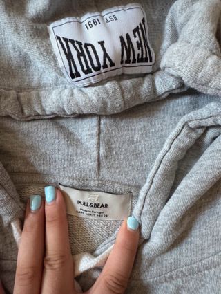 Chaqueta sin mangas con capucha gris