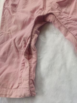 Conjunto peto rosa y body blanco