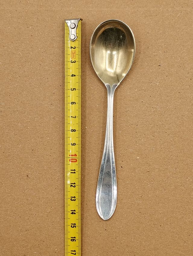 Cuchara pequeña plateada y dorada