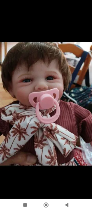 Muñeca bebé realista con accesorios