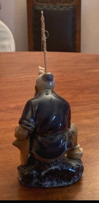 Statuina pescatore cinese