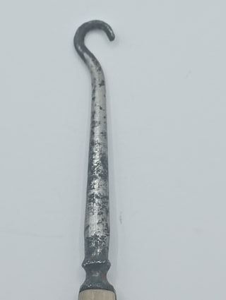 Gancho antiguo para botones