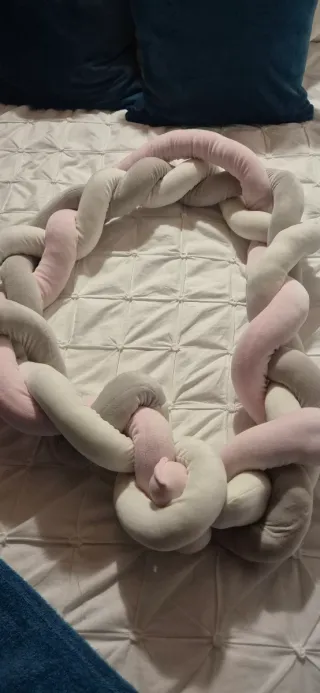 Cojín trenzado para cuna