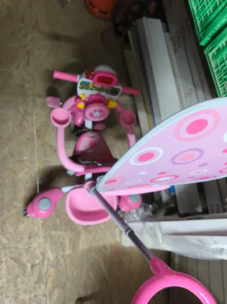Triciclo rosa per bambina con spintore