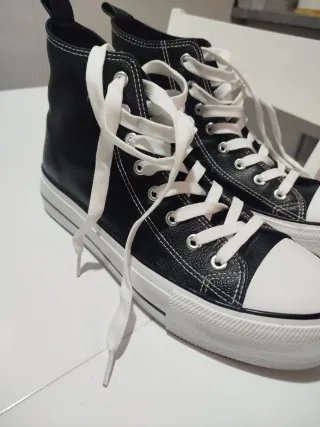 Zapatillas altas negras y blancas de piel