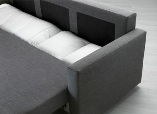 Sofá cama gris de tela