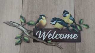 Letrero de metal con pájaros y Welcome