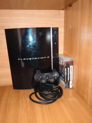 Console PS3 con controller e 3 giochi