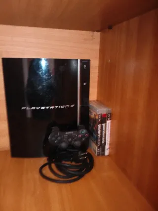 Console PS3 con controller e 3 giochi