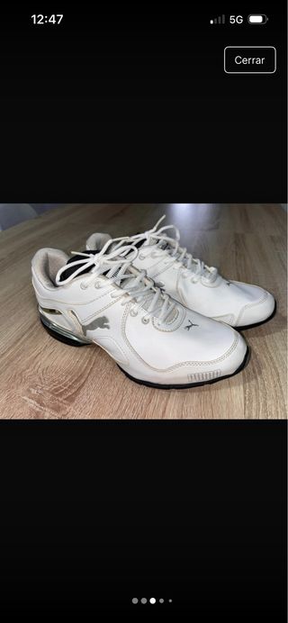 Zapatillas deportivas Puma blancas y plateadas
