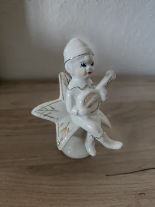 Figura porcelana antigua músico