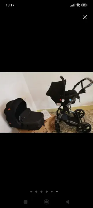Carrito de bebé y silla de coche negro