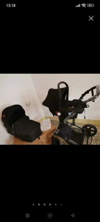 Carrito de bebé y silla de coche negro