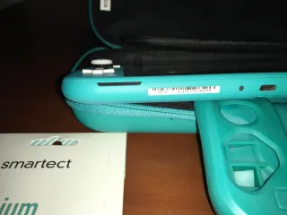 Nintendo Switch Lite como nueva con cargador y etc