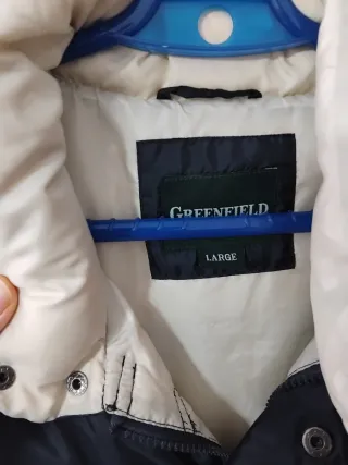 Chaleco acolchado negro y beige