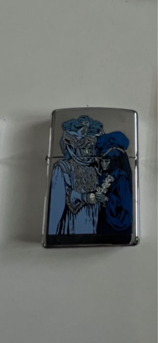 Zippo con diseño de máscaras venecianas