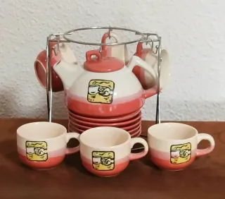 Juego de té/café cerámica con soporte metálico.
