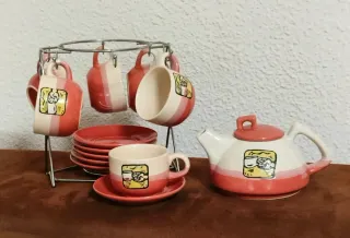 Juego de té/café cerámica con soporte metálico.