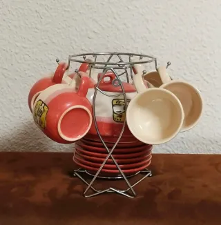 Juego de té/café cerámica con soporte metálico.