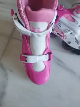 Patines en línea rosas y blancos.3 ruedas.30-34.