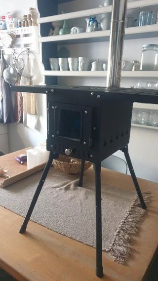 Estufa de leña portátil de acero con chimenea