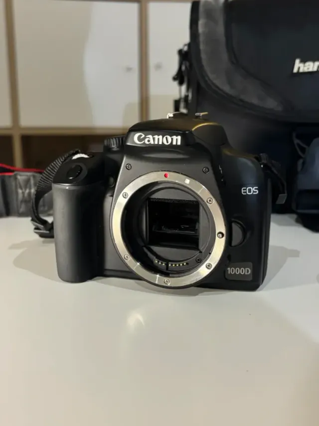 IMPECABLE Canon EOS 1000D