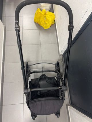 Carro de bebé negro y rosa